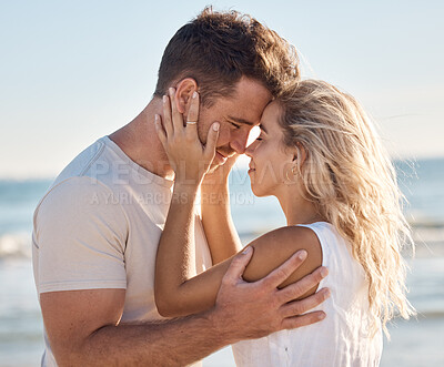 Buy stock photo Love, beach and couple with head together for intimacy, romance and joy on weekend. Relationship, happiness and young man and woman by ocean enjoying summer holiday, vacation and honeymoon in nature
