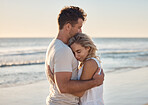 Dating, love and couple hug at the beach, happy after engagement on holiday, summer vacation and honeymoon. Nature, romance and happy man and woman embracing, hugging and bonding by ocean on weekend