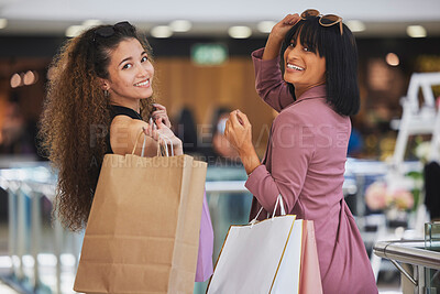 Buy stock photo Women, friends and shopping in mall, portrait and happiness, smile and excited to buy luxury products, fashion and discount sales. Happy customers, shopping bags and retail store, market and boutique