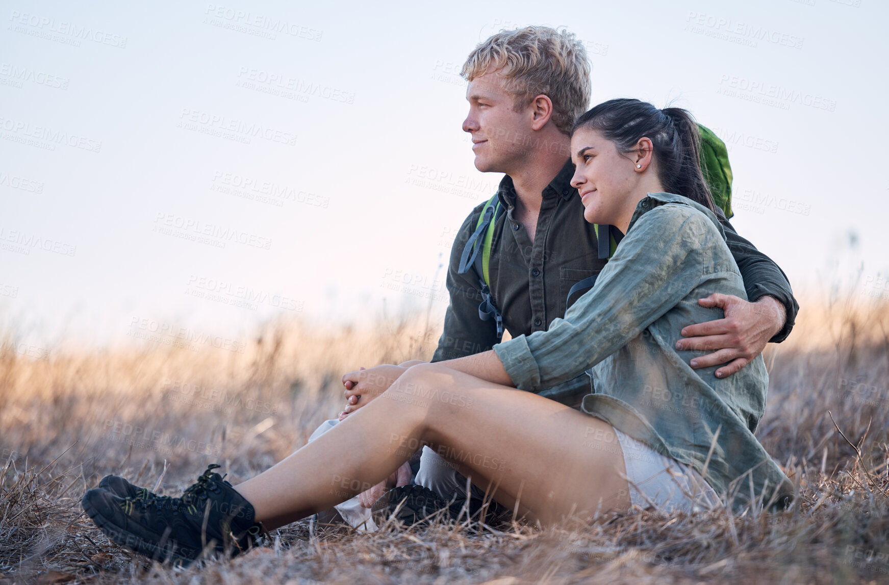 Buy stock photo Couple, relax and hug in nature for travel adventure or vacation freedom on grass. Friends, peace and zen happiness outdoor for happy zen lifestyle motivation together after mountain hike in summer