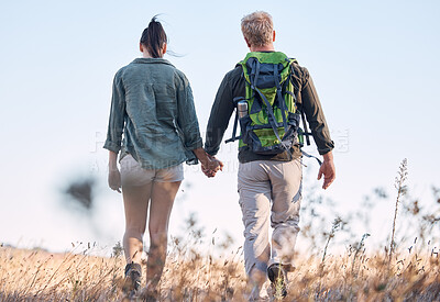 Buy stock photo Couple, holding hands and travel or backpack adventure in bonding relationship together in the countryside. Hands of man and woman backpacking, trekking or walking in care or support for traveling