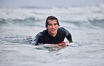 Portrait, man and surfing, ocean waves and water, summer freedom and happiness outdoors. Happy surfer guy on board, beach and sea, relax and happiness, sports adventure and vacation, swimming and sun