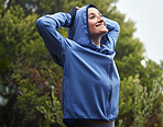 Exercise woman, winter fitness and stretching in nature, park and garden, fresh air and freedom, morning running and cardio training. Happy athlete, hoodie and workout warm up, hiking and motivation