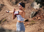 Woman runner, stretching and outdoor hiking on trail, hill or mountain for workout, fitness and health. Girl, warm up and running in nature for wellness, exercise and performance training in summer