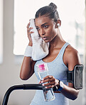 Black woman, gym and rest with towel for fitness, health and workout for strong body, muscle and focus. Woman, exercise and relax with cloth for sweat while training, running and cardio on treadmill