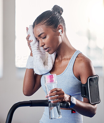 Buy stock photo Tired, sweating and towel, woman and water bottle, challenge or training fatigue, body struggle and gym exercise. Sports athlete girl taking a break to rest from difficult workout, fitness and health