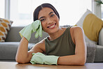 Cleaner, gloves for cleaning and woman with hygiene and protection against bacteria, housekeeping and cleaning service. Portrait of housekeeper, home maintenance and clean in living room.