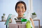 Cleaning supplies, happy portrait and woman, housekeeping, cleaning service and maintenance in home. Smile, young and female maid cleaner with basket of chemical detergent product for spring cleaning