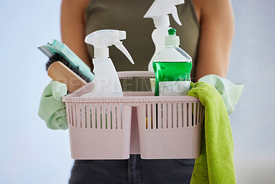 A Basket Full Of Cleaning Supplies And Cloths Stock Photo