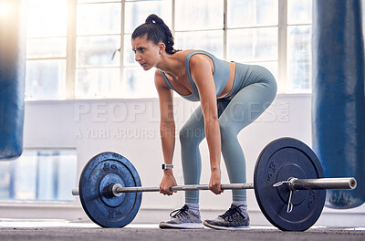 Buy stock photo Fitness, woman and weightlifting barbell for workout, exercise or intense training at the gym. Active female exercising and lifting weights in sports for arm strength, legs or squats at a health club