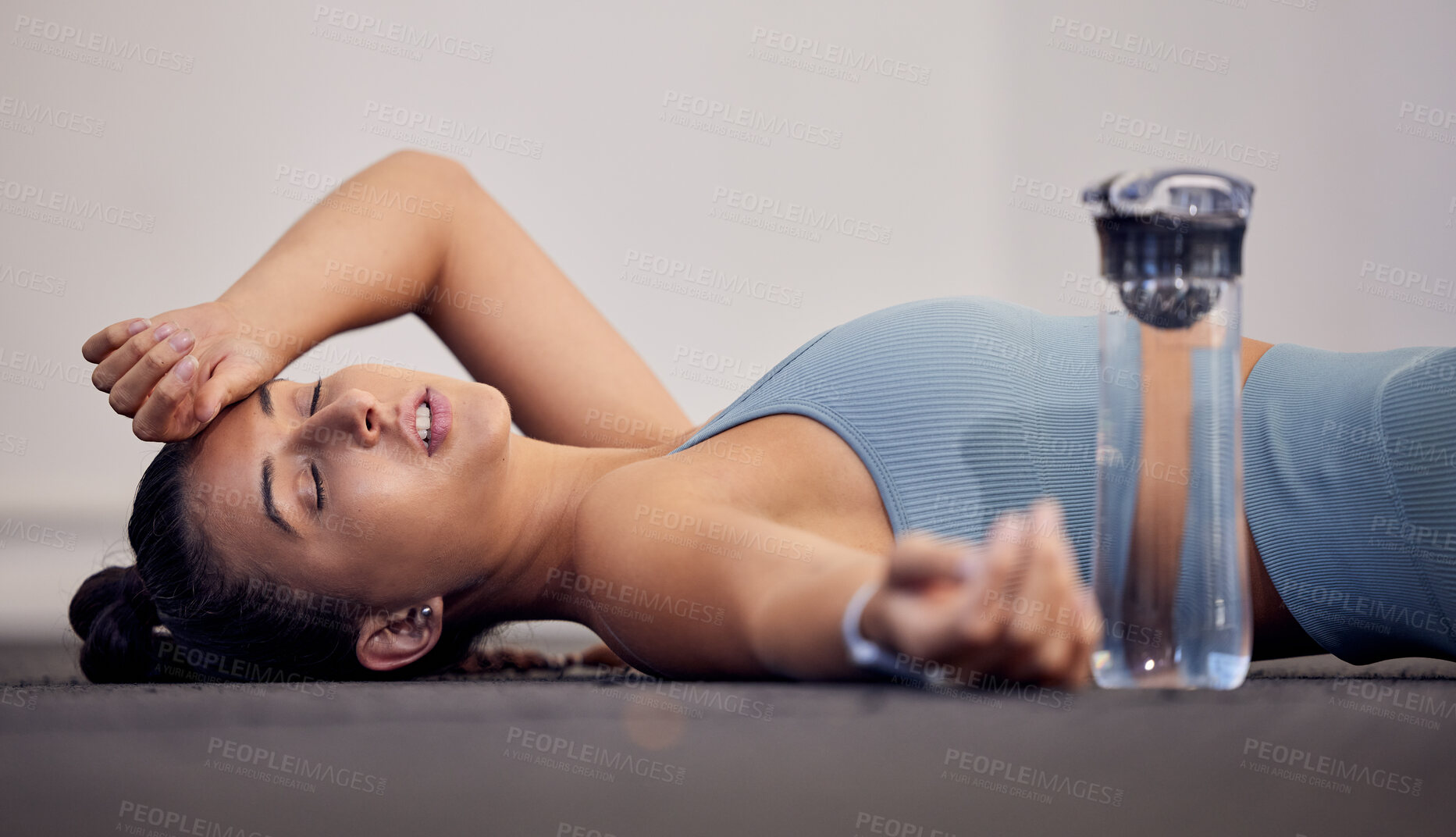 Buy stock photo Gym floor, fatigue and woman tired after intense workout, cardio training or yoga fitness exercise. Medical dehydration problem, emergency accident injury and sports athlete faint in pilates studio