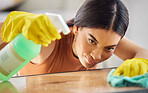 Black woman, hands and detergent for cleaning hygiene, domestic or health and safety from bacteria at home. African American female spraying wooden table, counter top or furniture for clean sanitary