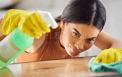 Buy stock photo Black woman, hands and detergent for cleaning hygiene, domestic or health and safety from bacteria at home. African American female spraying wooden table, counter top or furniture for clean sanitary