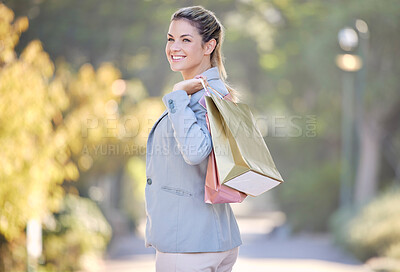 Buy stock photo Shopping, portrait and woman customer happy with retail sales, discount and promotion stock walking in park or outdoor in summer. Shopping bag, gift or present girl with wealth, rich and luxury life