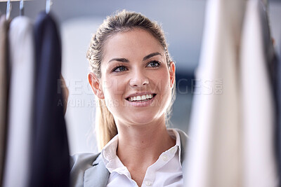 Buy stock photo Shopping, clothes and woman in a store for fashion choosing an outfit with material, fabric and texture. Happy, smile and girl looking at fancy or formal clothing in a retail shop or boutique.