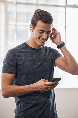 Buy stock photo Gym, man and smartphone, music and social media connection, fitness playlist and motivation, wellness or workout. Happy athlete, mobile app and audio radio listening, technology and training exercise