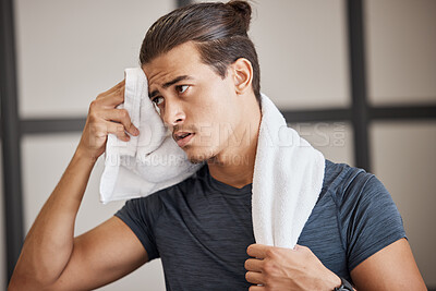 Buy stock photo Fitness, man sweat and tired fo exercise, training and fatigue in gym for health and wellness with towel. Man, young and gen z in sport club, healthy or workout with cloth for dry, sweat or skin 
