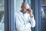 Stress, headache and tired African businessman outside the office taking a break from work. Frustrated, burnout and overworked professional manager working overtime at his workplace in the urban city