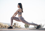 Fitness, exercise and woman stretching outdoor on a mountain road for health and wellness with cardio training. Athlete or sports model doing a workout in nature to prepare for a marathon or race