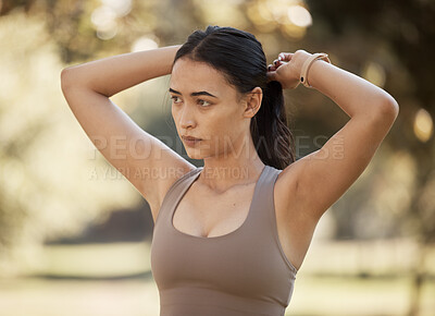 Buy stock photo Woman, fitness and tie hair at park for exercise, workout or running in summer sunshine for health. Girl, runner and focus outdoor for wellness, training and ready for healthy, strong body and cardio