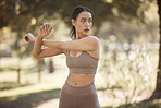 Arms stretching, fitness and woman outdoor in a park for exercise, wellness and sport workout. Runner health, sports and yoga training of a athlete in nature ready for running and morning activity