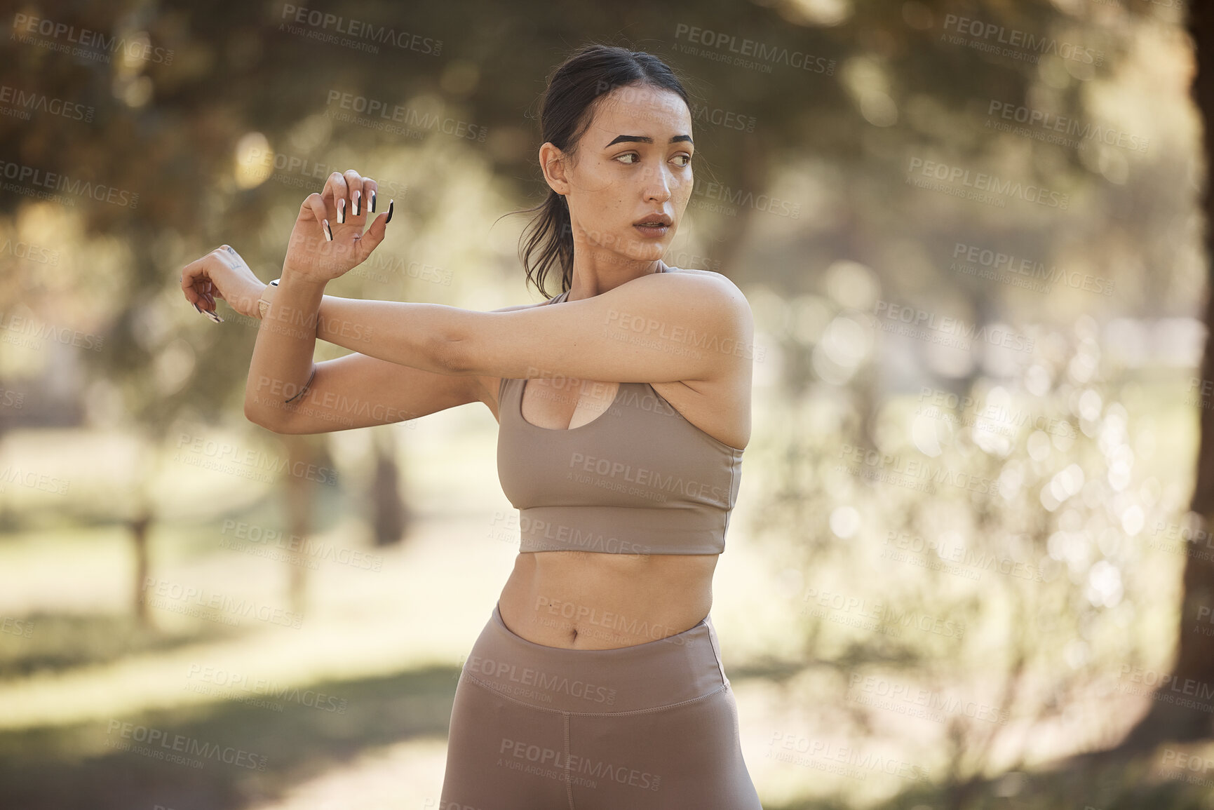 Buy stock photo Arms stretching, fitness and woman outdoor in a park for exercise, wellness and sport workout. Runner health, sports and training of a athlete in nature ready for running and morning activity