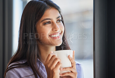 Buy stock photo Happy, woman and coffee at a window for relax, thinking and daydream about future, goal and ideas in her home. Face, tea and indian girl smile in her living room, enjoy calm drink and window view