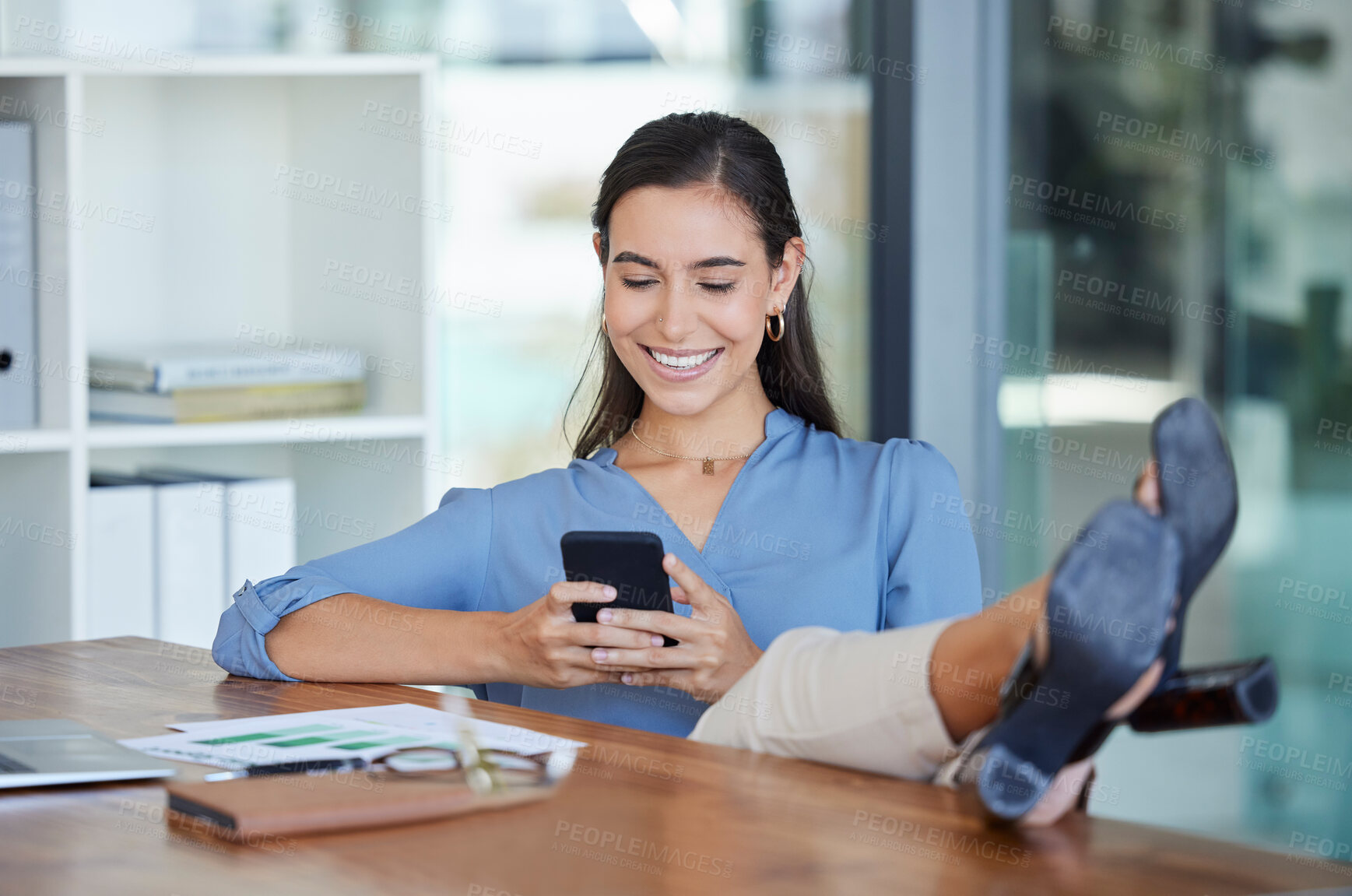 Buy stock photo Smile office and phone, typing with feet up on desk, relax while surfing internet or social media with smile on face. Communication, smartphone and happy businesswoman ceo writing text while on break