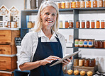 Success, tablet and woman manager of a small business, honey store or retail shop searching online. Smile, portrait and happy entrepreneur scrolling the internet for digital marketing advice or tips 