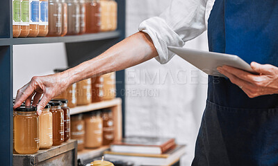 Buy stock photo Hands, tablet and honey jar for inventory check, inspection or pricing at the workplace. Hand of small business owner doing inspection working with touchscreen for product checking at the store