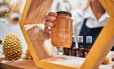 Buy stock photo Honey, product and retail with hands of woman and display shelf for grocery, natural and health food. Wellness, trader and organic with small business owner for sustainability, supermarket and store