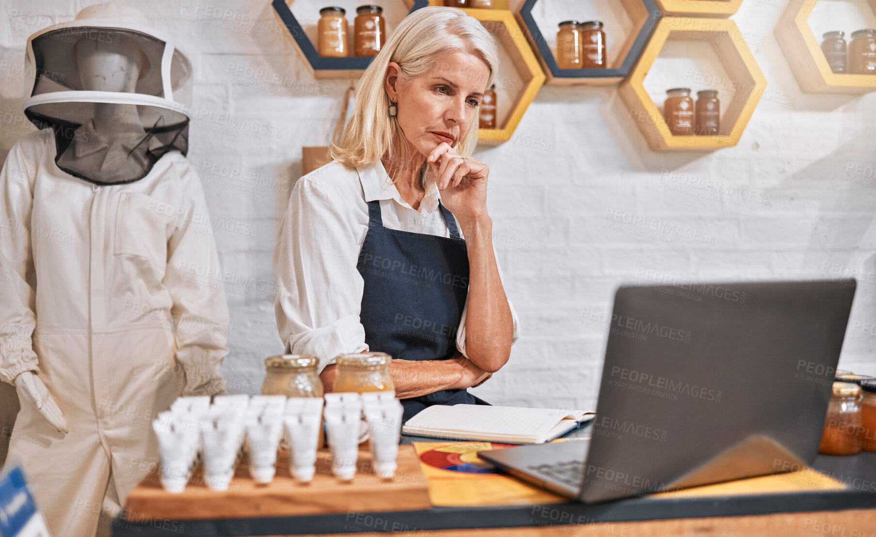 Buy stock photo Shop, stress and anxiety of owner at laptop with inflation, debt or bankruptcy update. Fear, risk and bills of professional honey store manager checking finance report online with worry.