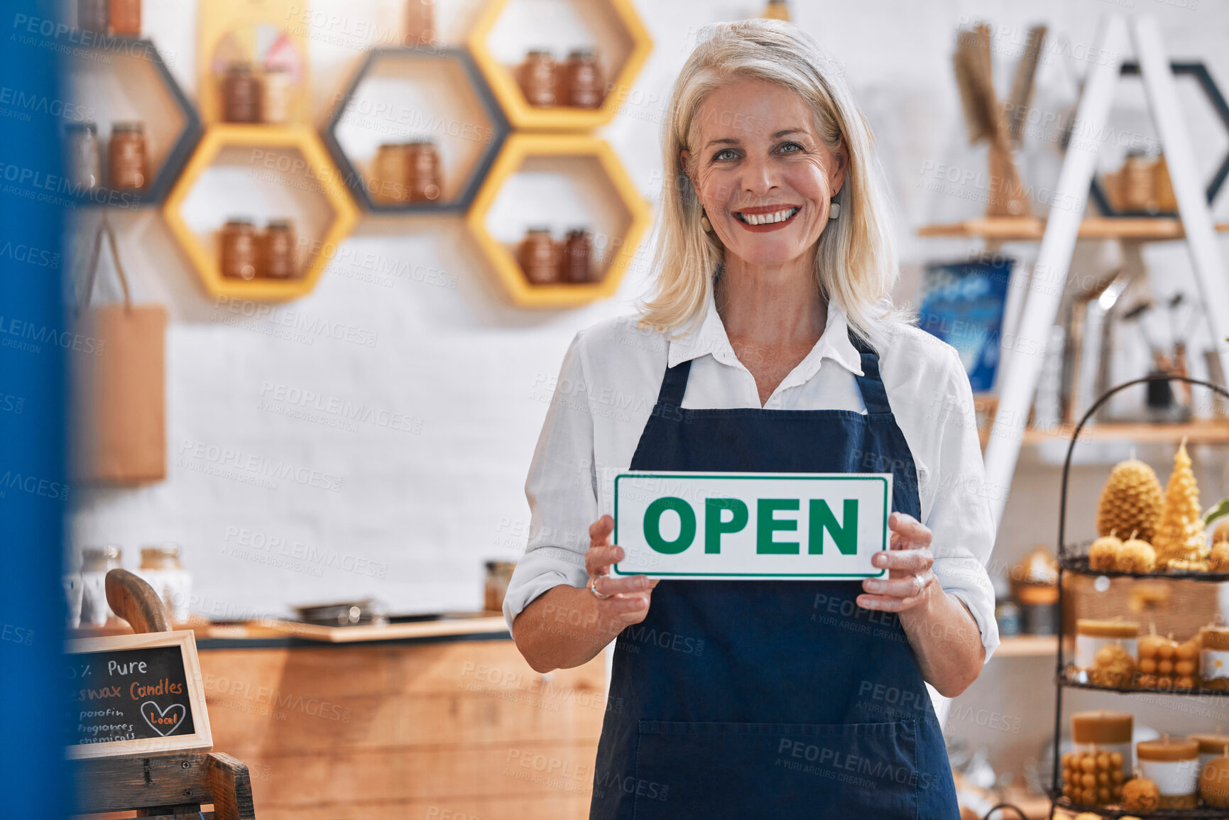 Buy stock photo Honey, entrepreneur or woman with an open sign advertising a retail shop or small business in the marketplace. Welcome, portrait and happy senior business owner ready to sell natural or organic food