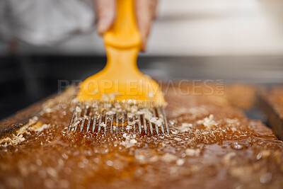 Buy stock photo Beekeeping, honey frame and production for sustainable farming with scraping tool and frame for honeycomb, beeswax and food industry. Hands of bee farmer or apiarist working with natural product