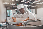 Woman, beekeeper and workshop, bee farming for honey and natural product, farm and small business owner with hive maintenance. Organic, bees and safety suit, elderly person smile in portrait.