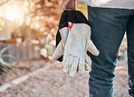 Farming, nature and hands with gloves for beekeeping, honey production and harvesting outdoors. Agriculture, natural products and beekeeper with protective gear getting ready for beehive inspection