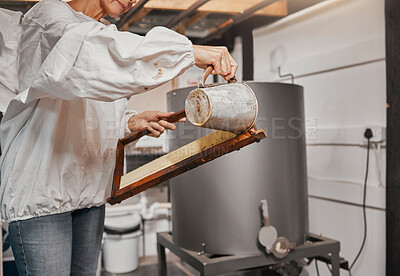 Buy stock photo Beekeeping, frame and senior woman preparing a bee frame for the production of honey at a farm. Small business, agriculture and beekeeper working on a honeycomb structure for bees for farming