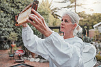 Beekeeping, honeycomb and agriculture with a woman farmer working in the production of honey in the countryside. Farm, sustainability and frame with a female beekeeper at work in natural industry