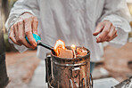 Hands, fire and beekeeping with a woman farmer using a smoker in the production of honey in the countryside. Agriculture, farm and sustainability with a female beekeeper working with a fogging tool