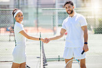 Game, tennis and portrait of athletes shaking hands for success, partnership and greeting. Handshake, fitness and sports man and woman training, practicing or playing match on an outdoor tennis court
