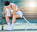 Tennis court, sports and tired woman with depression, stress and sad after loss, mistake or failure in competition or game on bench. Athlete female feeling sad, frustrated and burnout at training