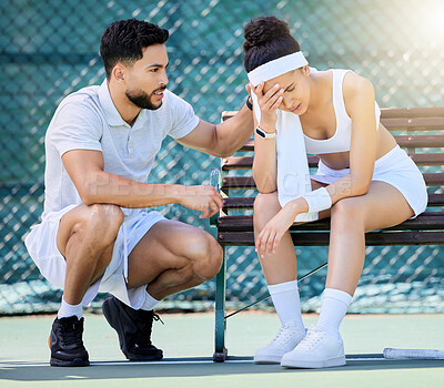 Buy stock photo Tennis, support and loss with a sports woman feeling sad while a male athlete tries to console or comfort her. Sad, fail and loser with a young female tennis player sitting on a bench after a game