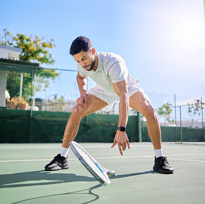 Buy stock photo Tennis, sports and knee pain on court after training, match or game outdoors. Healthcare, male athlete or tennis player drop racket with leg injury, inflammation or joint pain after exercise accident