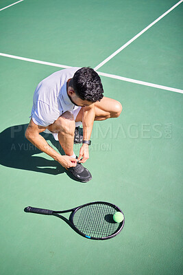 Buy stock photo Tennis, tie and man with shoes on a court for sports training, fitness exercise or cardio workout in summer in Spain. Wellness, athlete or tennis player ready to start playing a game on tennis court