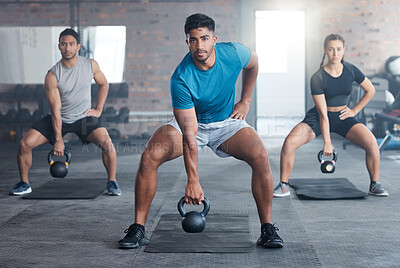 Buy stock photo Fitness, kettlebell weight and people doing an exercise for strength, wellness or health together in a gym. Sports, motivation and athletes doing a squat workout with personal trainer in sport studio
