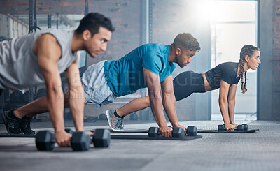 Buy stock photo Group, workout and dumbbell push up at gym for muscle, power or strength. Teamwork, sports or energy of people, athletes or bodybuilder friends exercise or training at fitness center for healthcare.
