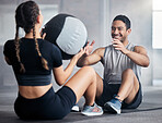 Fitness, ball and couple doing an exercise together for health, wellness and strength in the gym. Sports, healthy and strong man and woman athletes doing a workout or training in a sport center.