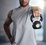 Fitness, exercise and man with kettlebell for weight training and workout for health and wellness at gym. Hand of strong athlete or bodybuilder with metal for healthy lifestyle and muscle motivation