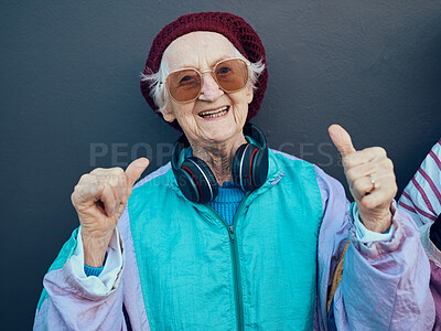 Buy stock photo Senior woman, thumbs up and headphones for stylish fashion, glasses or modern lifestyle and happiness freedom. Yes, hands and streaming music or portrait of happy, funky elderly person with smile 