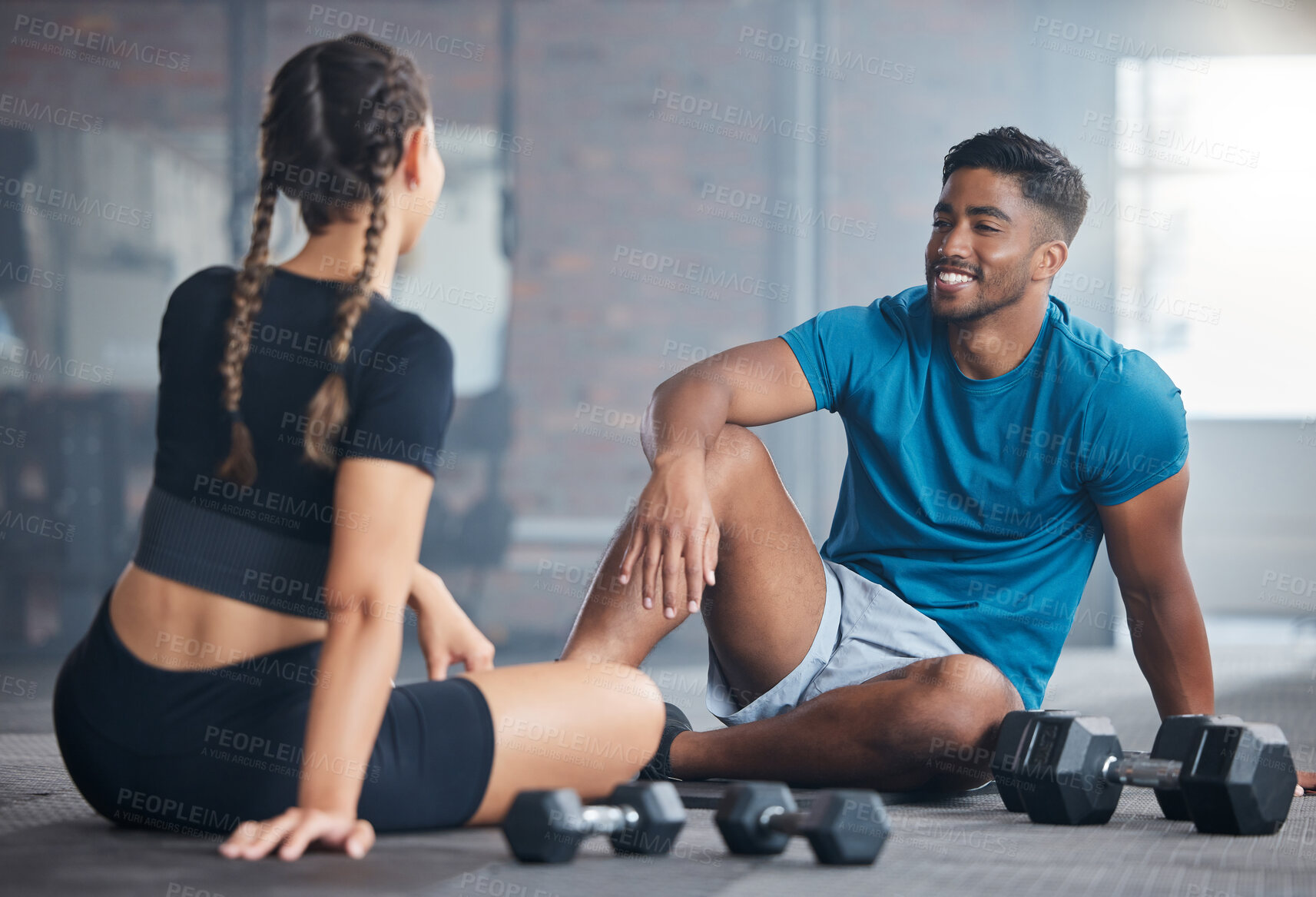 Buy stock photo Fitness, exercise and couple talking after gym. workout while on floor for communication and conversation about health, motivation and wellness. Personal trainer man and woman together for training